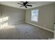 Bright bedroom with carpeted floor and ceiling fan at 2260 Pearl Rd., Galivants Ferry, SC 29544