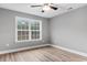 Well-lit bedroom with wood-look floors and a large window at 2260 Pearl Rd., Galivants Ferry, SC 29544