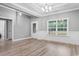 Elegant dining room, wainscoting, and chandelier at 2260 Pearl Rd., Galivants Ferry, SC 29544