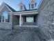 Brick home with covered porch and dormer windows at 2260 Pearl Rd., Galivants Ferry, SC 29544