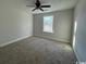 Cozy bedroom with carpet, ceiling fan, and window at 2264 Pearl Rd., Galivants Ferry, SC 29544