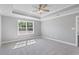 Spacious bedroom with carpet flooring and a large window at 2264 Pearl Rd., Galivants Ferry, SC 29544