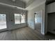 Formal dining room with chair rail, hardwood floors, and access to the kitchen at 2264 Pearl Rd., Galivants Ferry, SC 29544