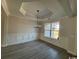 Bright dining room with wainscoting, chandelier, and hardwood floors at 2264 Pearl Rd., Galivants Ferry, SC 29544