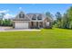 Brick home with a 2-car garage and landscaped lawn at 2264 Pearl Rd., Galivants Ferry, SC 29544