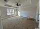 Large main bedroom with neutral carpeting and large window at 2264 Pearl Rd., Galivants Ferry, SC 29544