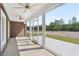 Screened porch with brick wall and view of backyard at 2264 Pearl Rd., Galivants Ferry, SC 29544