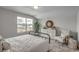 Serene bedroom with a metal bed frame and seating area at 313 Mayflower Dr., Calabash, NC 28467