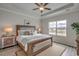 Bright bedroom featuring a king-size bed and decorative rug at 313 Mayflower Dr., Calabash, NC 28467