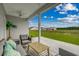 Relaxing covered patio furnished with seating and a coffee table at 313 Mayflower Dr., Calabash, NC 28467