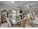 Modern dining room with concrete table, wicker chairs, and shelving at 313 Mayflower Dr., Calabash, NC 28467