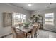 Dining area with concrete table, wicker chairs, and decorative wall art at 313 Mayflower Dr., Calabash, NC 28467