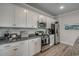 Modern kitchen with stainless steel appliances and granite countertops at 313 Mayflower Dr., Calabash, NC 28467