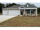 Newly built home with two-car garage and attractive landscaping at 364 Mayflower Dr., Calabash, NC 28467