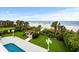 Inviting backyard with a private pool and a scenic view of the ocean and sandy beach at 8000 Beach Dr., Myrtle Beach, SC 29572