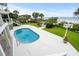 Inviting pool and backyard that offers serene beach views and lush tropical landscaping at 8000 Beach Dr., Myrtle Beach, SC 29572