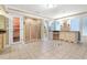 Spacious bathroom featuring a tiled shower, vanity, and adjacent sauna at 8000 Beach Dr., Myrtle Beach, SC 29572