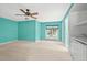 Spacious bedroom with light teal walls and neutral carpet at 8000 Beach Dr., Myrtle Beach, SC 29572