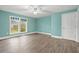 Empty bedroom with light teal walls and wood flooring at 8000 Beach Dr., Myrtle Beach, SC 29572