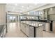 Modern kitchen featuring granite countertops, stainless steel appliances, an island, and ocean views at 8000 Beach Dr., Myrtle Beach, SC 29572