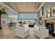 Expansive living room with fireplace, bar, and ocean view windows for a bright and open space at 8000 Beach Dr., Myrtle Beach, SC 29572