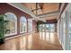 Bright living room with hardwood floors, vaulted ceilings, and ocean views at 8000 Beach Dr., Myrtle Beach, SC 29572