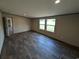 Bedroom with vinyl flooring, natural light, and neutral paint at 2500 Newton Rd., Aynor, SC 29511