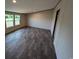 Bedroom with vinyl flooring, natural light from large windows, and neutral paint at 2500 Newton Rd., Aynor, SC 29511