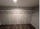 A walk-in closet with wood grain vinyl flooring and a hanging rack at 2500 Newton Rd., Aynor, SC 29511