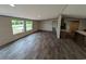 Living room with vinyl flooring, recessed lighting, and large windows that provide natural light at 2500 Newton Rd., Aynor, SC 29511