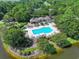 Aerial view of community pool, clubhouse, and meticulously maintained landscaping at 1237 Clipper Rd., North Myrtle Beach, SC 29582