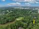Aerial view of home nestled among lush green trees, close to a golf course at 1237 Clipper Rd., North Myrtle Beach, SC 29582