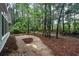 Private backyard patio surrounded by lush trees at 1237 Clipper Rd., North Myrtle Beach, SC 29582