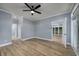 Bedroom with hardwood floors, ceiling fan and access to sunroom at 1237 Clipper Rd., North Myrtle Beach, SC 29582