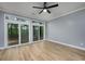 Spacious bedroom with wood flooring, ceiling fan and sliding glass doors to exterior at 1237 Clipper Rd., North Myrtle Beach, SC 29582