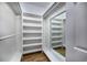 Large walk-in closet with built-in shelves and a mirror at 1237 Clipper Rd., North Myrtle Beach, SC 29582