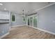 Dining area featuring a sliding glass door, modern lighting, and breakfast bar at 1237 Clipper Rd., North Myrtle Beach, SC 29582