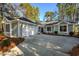 Charming home with a garage and driveway, surrounded by mature trees at 1237 Clipper Rd., North Myrtle Beach, SC 29582