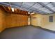 Large garage with exposed ceiling, multiple doors, and room for storage at 1237 Clipper Rd., North Myrtle Beach, SC 29582