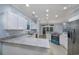 Modern kitchen with granite countertops and a teal stove at 1237 Clipper Rd., North Myrtle Beach, SC 29582