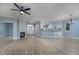 Spacious living room with fireplace, ceiling fan, and open layout at 1237 Clipper Rd., North Myrtle Beach, SC 29582