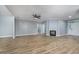 Bright and spacious living room featuring a fireplace, ceiling fan, and open floor plan at 1237 Clipper Rd., North Myrtle Beach, SC 29582
