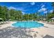 Relaxing kidney-shaped pool surrounded by lush greenery at 1237 Clipper Rd., North Myrtle Beach, SC 29582