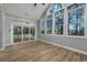 Bright sunroom features wood floors, vaulted ceilings and large windows for natural light at 1237 Clipper Rd., North Myrtle Beach, SC 29582
