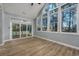 Sunroom with wall of windows, hardwood floors and sliding glass doors at 1237 Clipper Rd., North Myrtle Beach, SC 29582