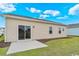 Simple backyard showcasing a sliding glass door, patio, and a well-kept lawn at 3038 Deerberry Place, Longs, SC 29568