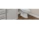 This bathroom features a white toilet, vanity, and a tiled floor at 3038 Deerberry Place, Longs, SC 29568