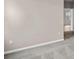 Carpeted bedroom featuring light-colored walls and an entryway into the next room at 3038 Deerberry Place, Longs, SC 29568