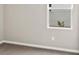 A clean bedroom offers natural light through a window and neutral carpet at 3038 Deerberry Place, Longs, SC 29568