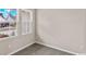 A corner bedroom with large windows and hardwood flooring provides a bright and airy space at 3038 Deerberry Place, Longs, SC 29568